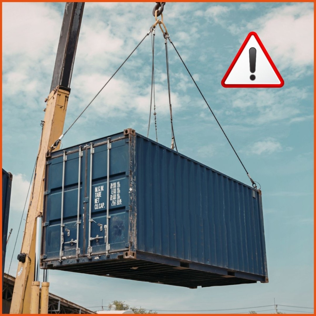 Shipping container being loaded on a ship