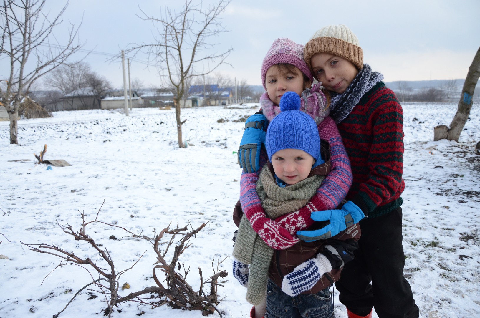 Kids try to stay warm during Eastern Europe's cold winters