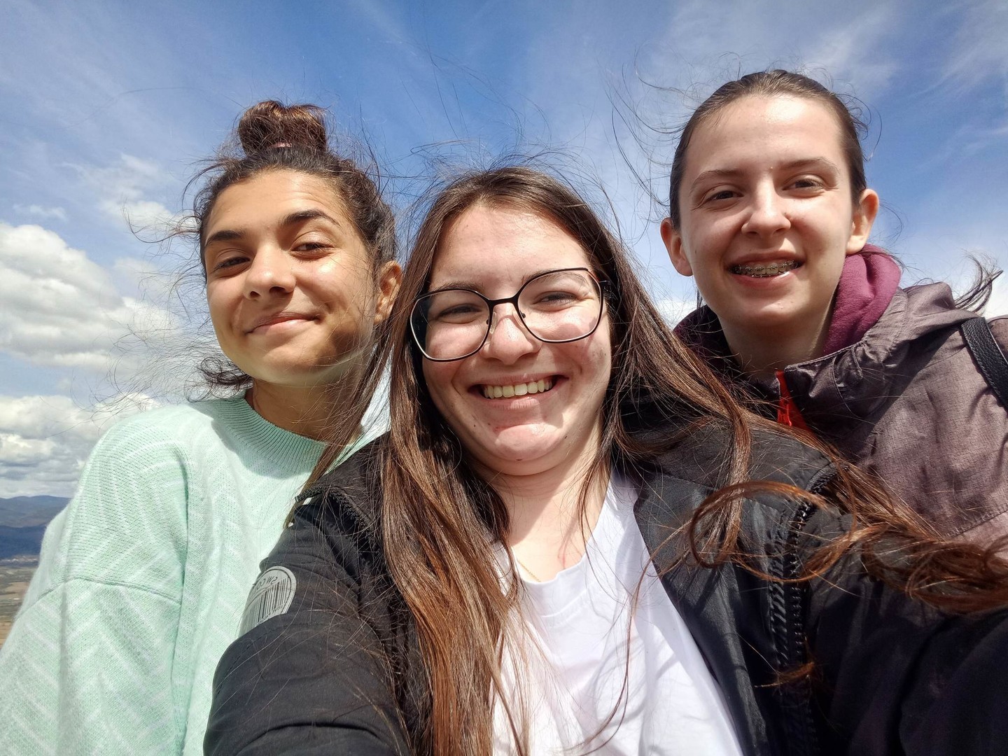Three smiling girls, youth from church.