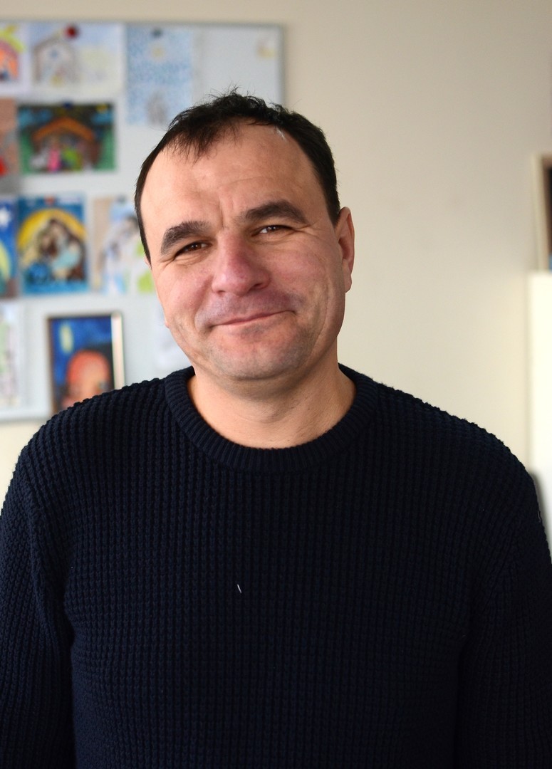 MWB coordinator with a slight smile.