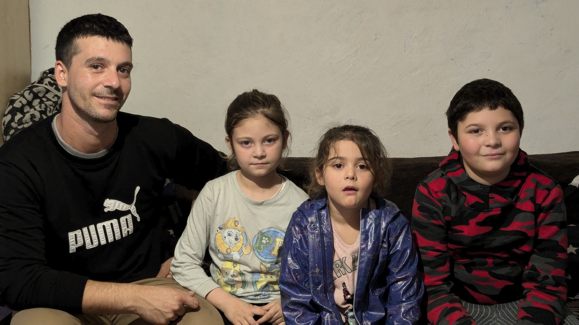 A father with his children at home