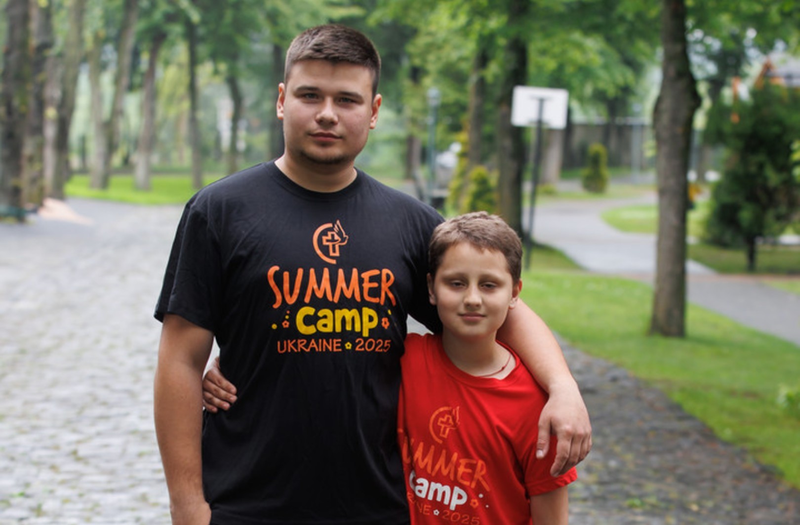Grygoriy at summer camp with team leader Valentyn