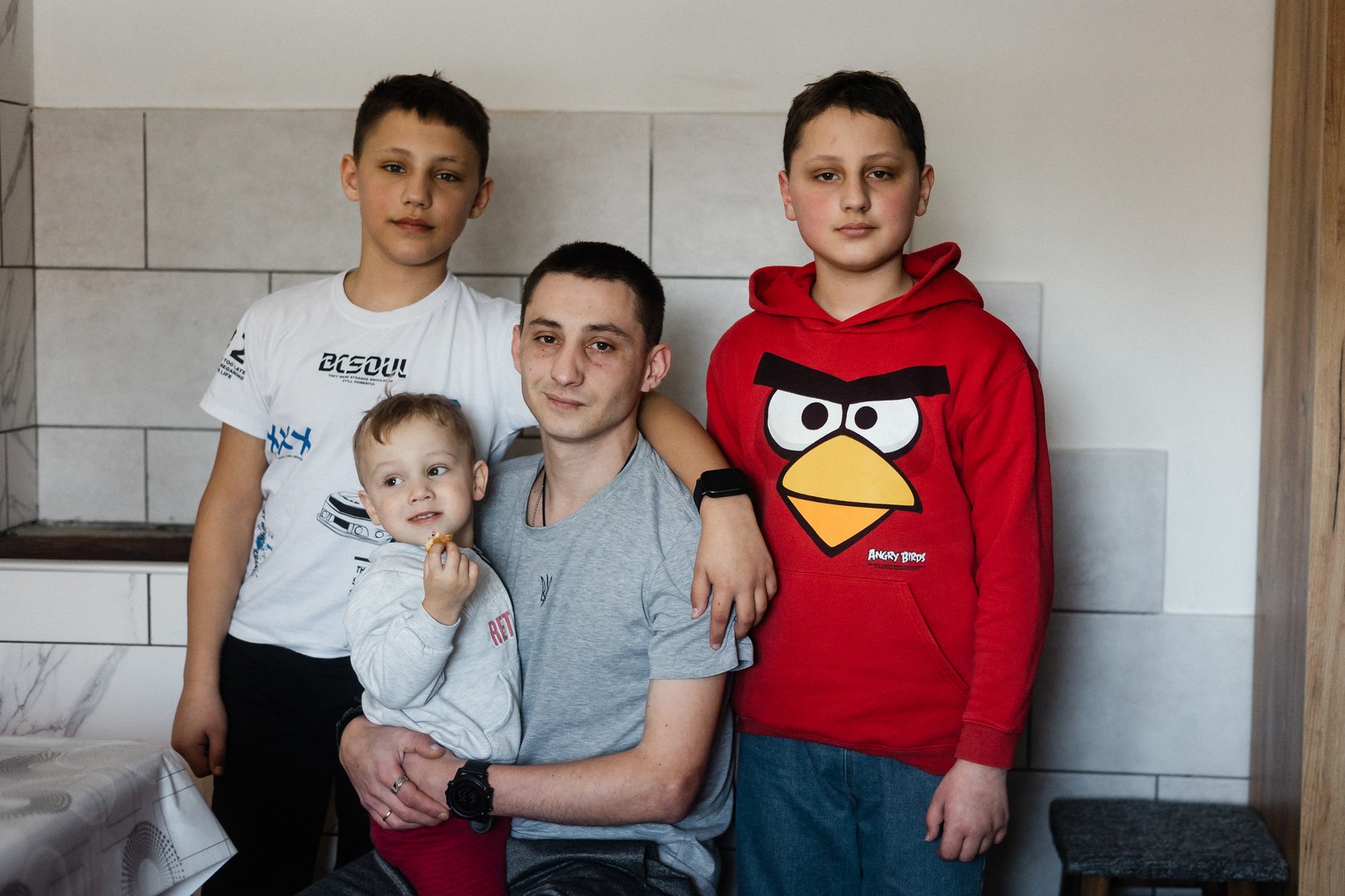 Grygoriy on the right with his father and brothers.